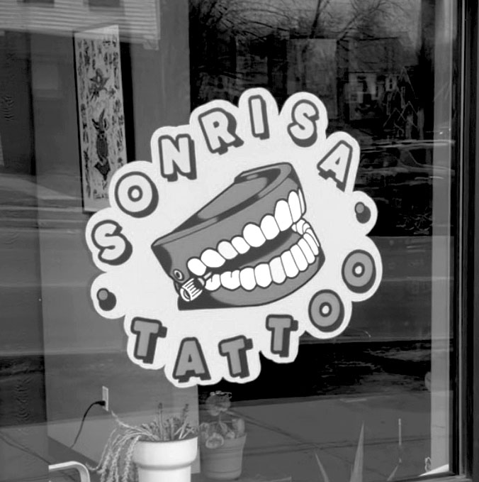 Picture of the Sonrisa Tattoo Window Sign